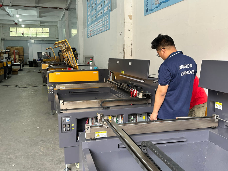 Technician working on laser equipment in the Dragon Diamond workshop