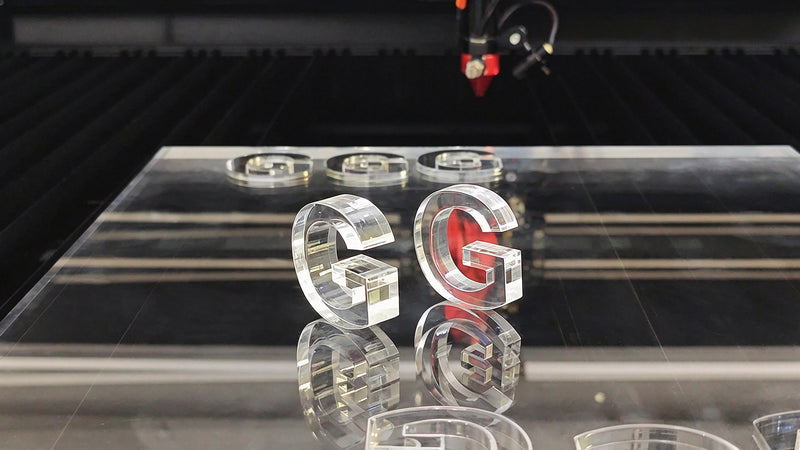 Clear laser-cut acrylic letters for branded display details