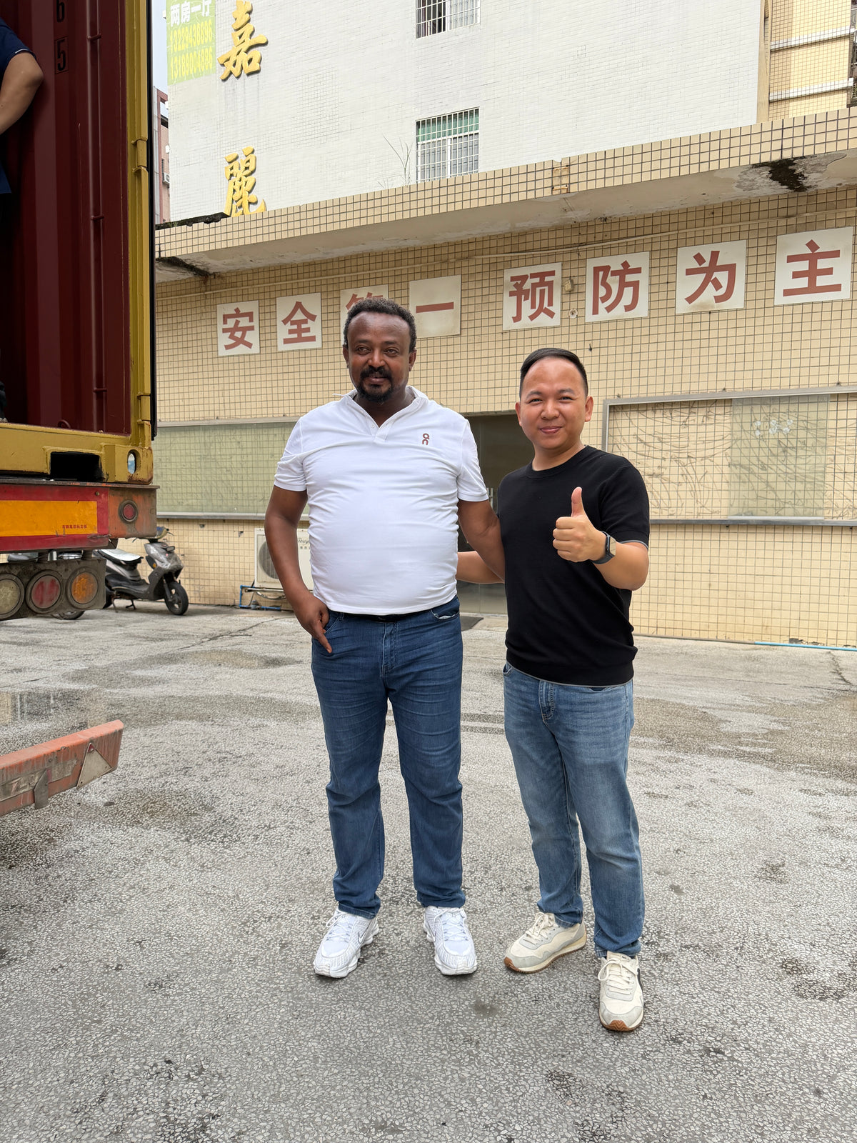 Customer and Dragon Diamond representative beside the shipping container