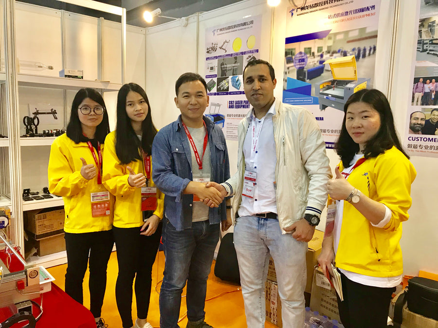 Dragon Diamond representatives meeting visitors at an exhibition booth