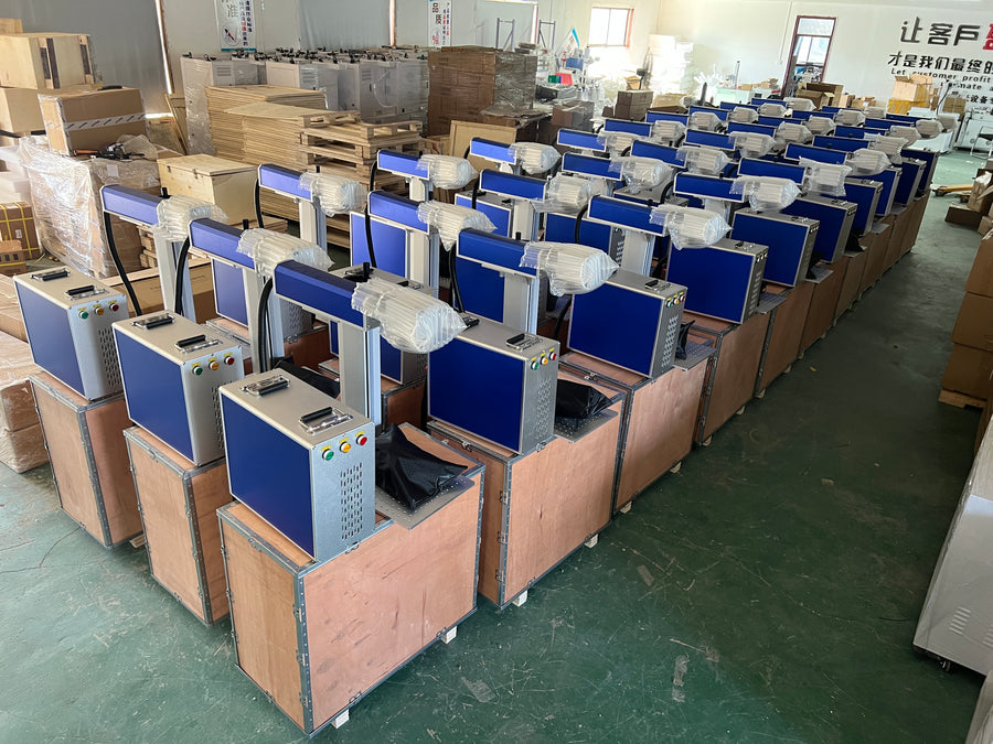A group of machines positioned in wooden packing bases