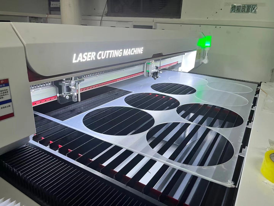 Patterned material positioned on a laser cutting bed