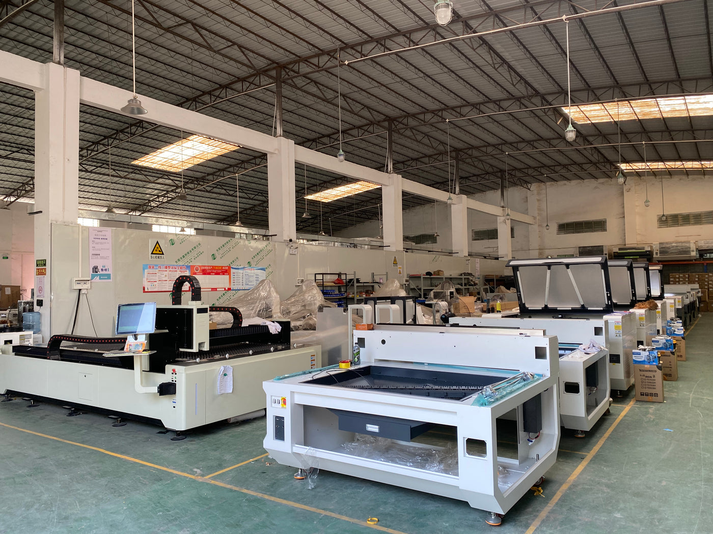 Laser cutting machines and CNC equipment inside the Dragon Diamond workshop