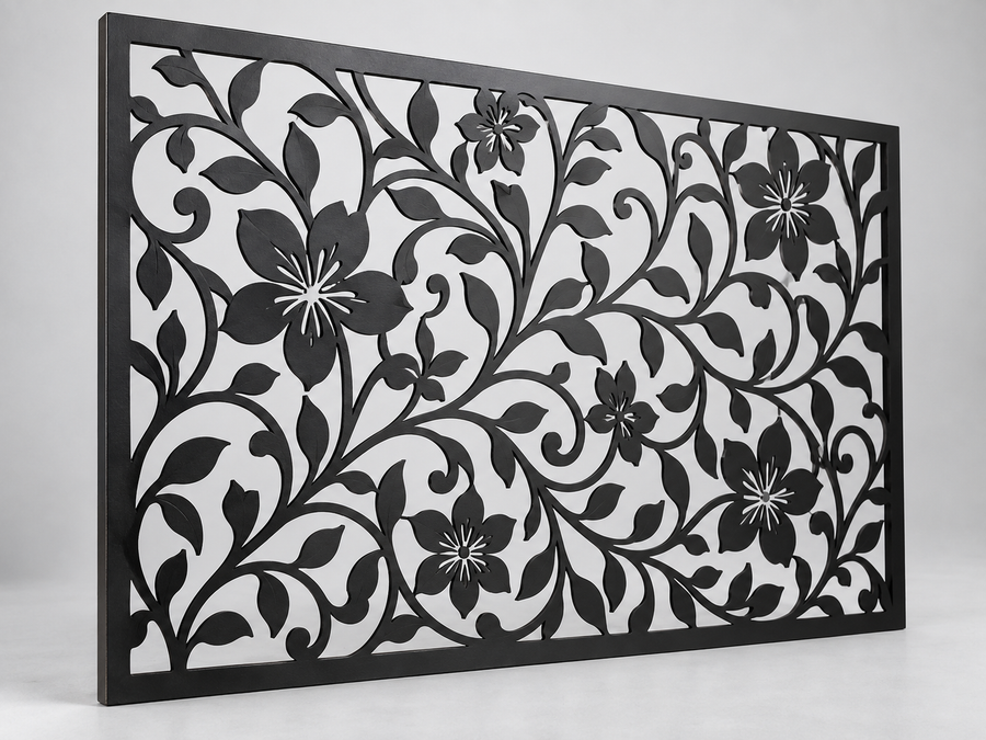 Decorative metal panel with floral and leaf cutout patterns